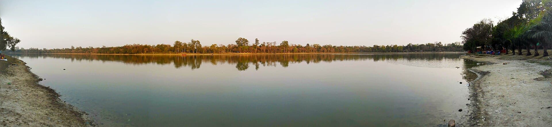 Water and wooded bank of Ramsagar lake in Dinajpur