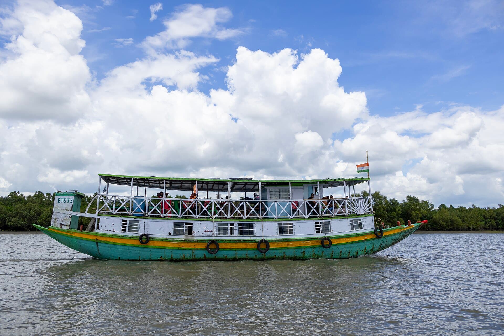 Tourist boat moving through a Sundarbans channel